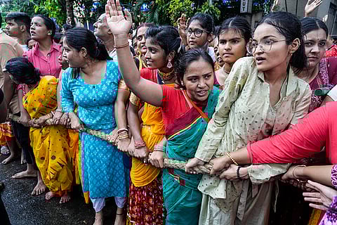 Devotees pull a chariot in Kolkata